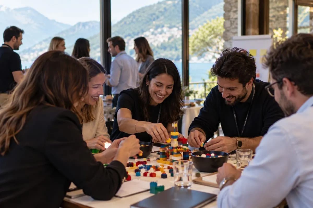 Colleagues building with bricks at a team workshop