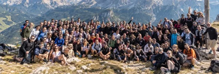 Large team group photo on a mountain top